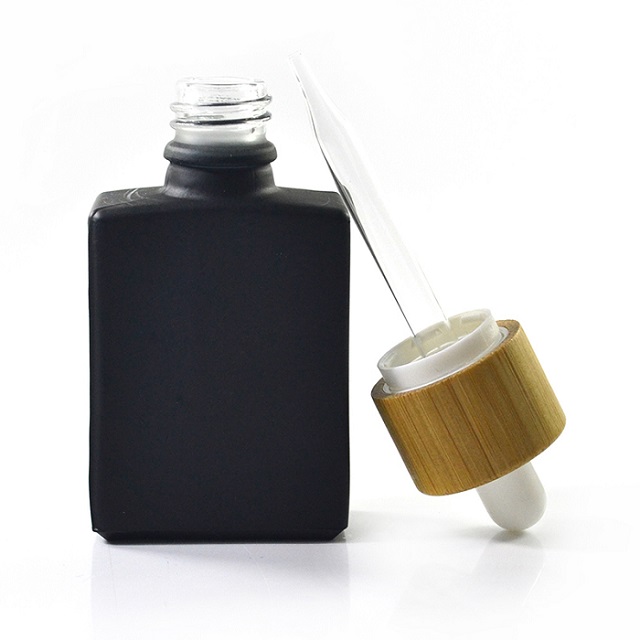 Glass dropper bottle with bamboo lid Tropfflasche aus Glas mit Bambusdeckel