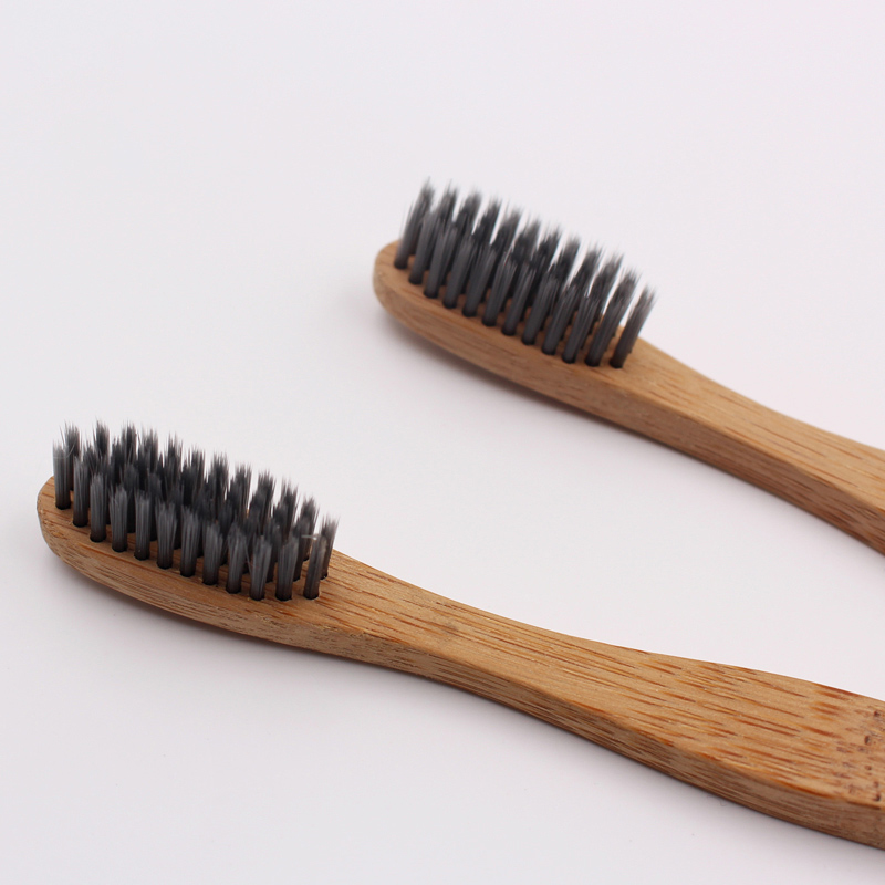 Cepillo de dientes de bambú con mango grueso y forma de onda