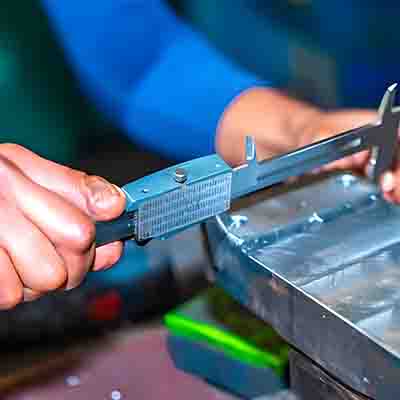 Measure the part with a caliper